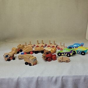 Assorted small wood vehicles..train, dumo truck, race cars...